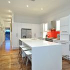 Modern Hitech Decorated Vibrant Modern Hitech Mansion Kitchenette Decorated With Clear White Kitchen Cabinet And Kitchen Islands With Bar Stools Interior Design Beautiful Interior Design In Modern Hi-Tech Mansion House Of Paddington