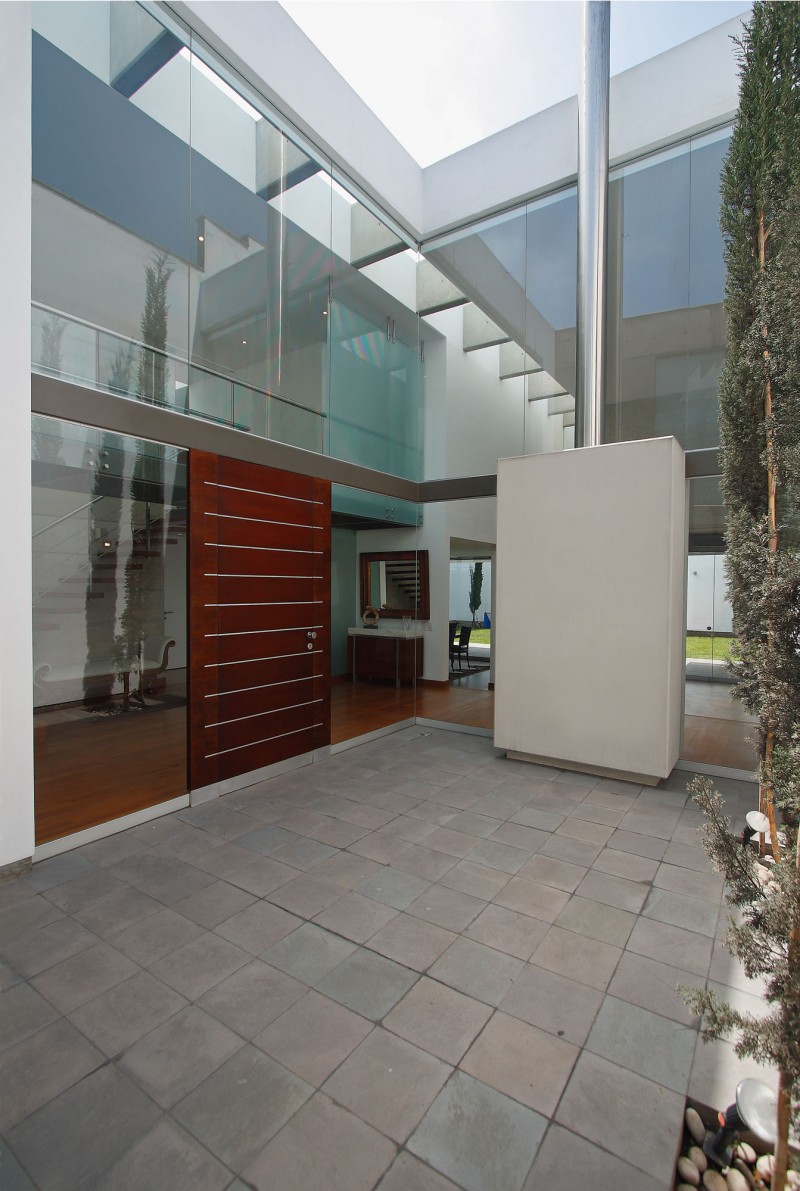 Entrance Of Residence Wide Entrance Of The Patio Residence With Wooden Door And Stone Floor Near The Glass Walls Dream Homes Stunning White Home With Authentic Patio In Modern Style