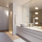Mirror And Above Wide Mirror And Bright Lamps Above Long White Vanity And White Sink Inside Scandinavian Apartment Stockholm Bathroom Interior Design Excellent Cozy Interior Using Wooden Construction Domination