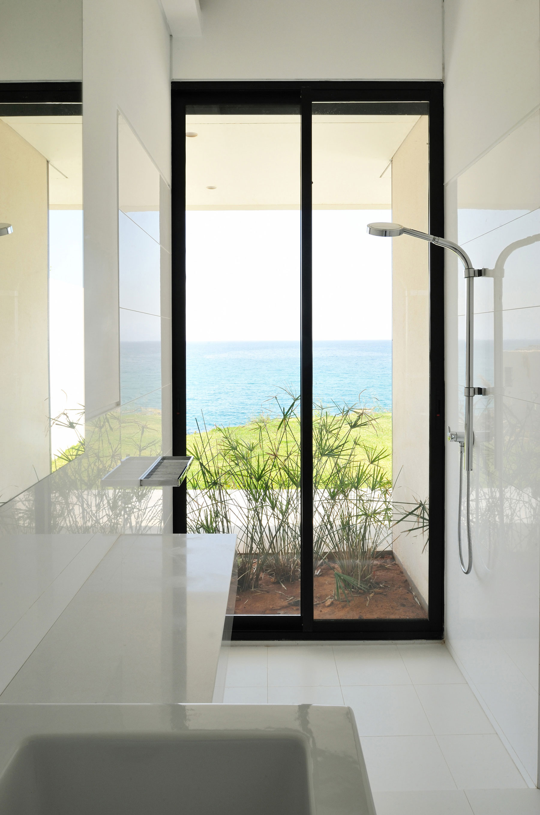 Beach View Plants Wonderful Beach View And Ornamental Plants Fidar Beach House Interior Glass Door In Dark Frame Stainless Steel Shower Porcelain Washing Stand  Futuristic Modern Beach House With Neutral Color Palettes For A Family Of Five