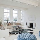 Details In London Amazing Details In The Modern London House Living Room With Small Tables And White Sofas Facing Black Fireplace Dream Homes Elegant Simple Interior Design Maximizing Bright White Color Scheme