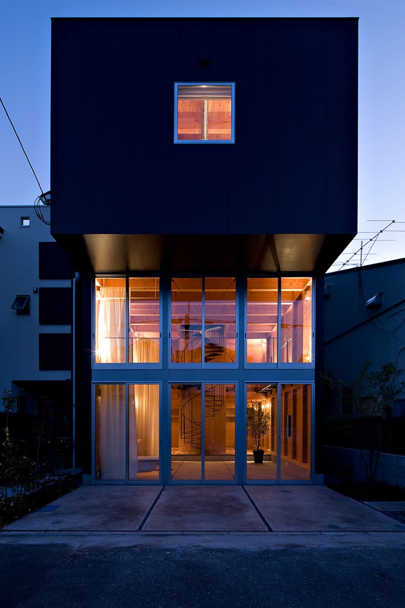 Front Yard Of Amazing Front Yard Entrance Design Of House In Waga Zaimokura With Soft Grey Color Marble Floor And Bright Orange Lighting From Inside Dream Homes  Stunning Cantilevered House With Sophisticated And Natural Wooden Interiors