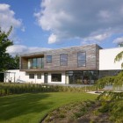 Front Yard Of Amazing Front Yard Landscape Design Of Meadowview Residence With Vast Green Grass Garden And Several Green Tall Trees Dream Homes Charming Airy Interior To Enhance The Coziness Of Elegant Modern Home