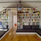 Attic Home Displayed Appealing Attic Home Library Design Displayed In White Rams Ceiling And Wall Included White Closet And Black Seats Interior Design Nice Home Library With Stunning Black And White Color Schemes
