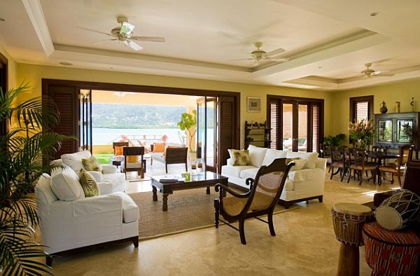 Tropical Living Idea Appealing Tropical Living Room Design Idea With White Sofas And Wooden Chair Near Wooden Table On Brown Carpet Dream Homes Impressive Interior Decorating Ideas For Colorful Apartments In Caribbean Style