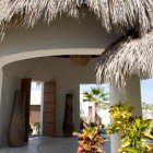 Building Design Grey Captivating Building Design Of Villa Grey Cape With Dark Colored Straw Rooftop And White Concrete Wall Interior Design Fabulous Relaxing Interior From Villa Grey Cape In Mexico