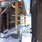 Wooden Railing Of Captivating Wooden Railing In Front Of The Boisset House With Wooden Doors And Wooden Striped Wall Beautified With Snow Interior Design Beautiful Minimalist Cabins That Make Gorgeous Holiday Homes