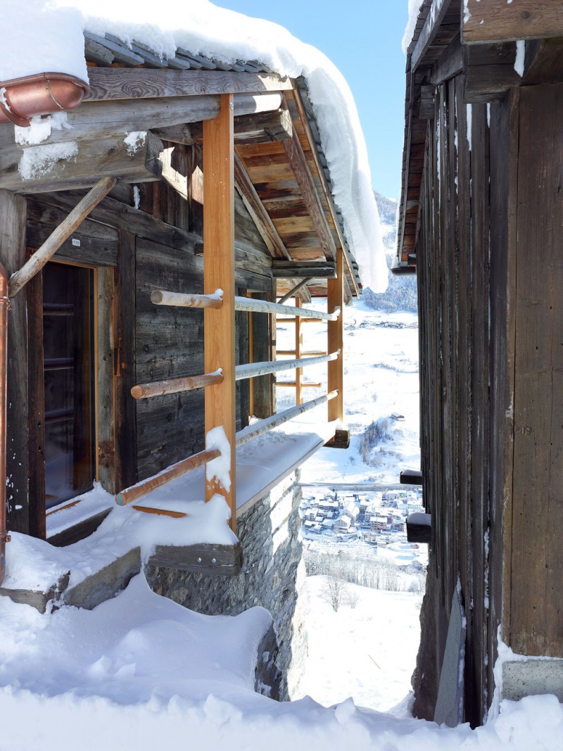 Wooden Railing Of Captivating Wooden Railing In Front Of The Boisset House With Wooden Doors And Wooden Striped Wall Beautified With Snow Interior Design Beautiful Minimalist Cabins That Make Gorgeous Holiday Homes