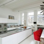 White Kitchen London Contemporary White Kitchen In Modern London House With Long White Island And White Stools Near Red Chairs Dream Homes Elegant Simple Interior Design Maximizing Bright White Color Scheme