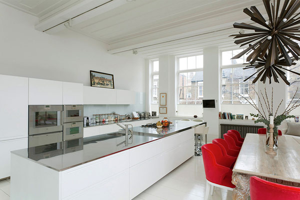 White Kitchen London Contemporary White Kitchen In Modern London House With Long White Island And White Stools Near Red Chairs Dream Homes Elegant Simple Interior Design Maximizing Bright White Color Scheme