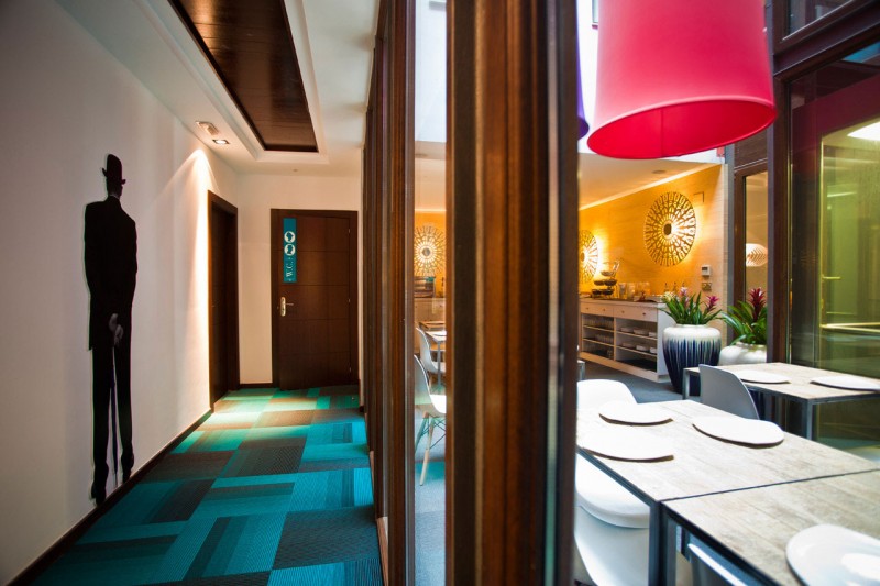 View By And Cool View By Dining Table And Corridor Area In Hotel Portago Urban Showing Nice Floor And Wooden Table Decor Hotels & Resorts  Bright Modern Interiors With Vibrant Pops Of Colors For Hotels