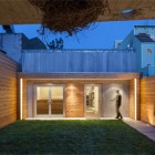 With Neat Completed Courtyard With Neat Green Grass Completed With Outdoor Lighting Decoration Secluded Modern Wooden Home With Beautiful Minimalist Interior