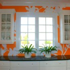 Wall Design And Creative Wall Design With White And Orange Color Feat Glass Cabinet Feat Windows Which Facing Planters Area Interior Design Chic And Tropical Interior Design For Sweet Contemporary Homes