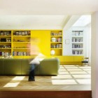 Chevron Residence Books Excellent Chevron Residence Completed Original Yellow Bookshelves With Yellow Cabinets On The White Painted Wall And White Table Lamp On It Dream Homes Elegant And Vibrant Interior Design For Stunning Creative Brick House