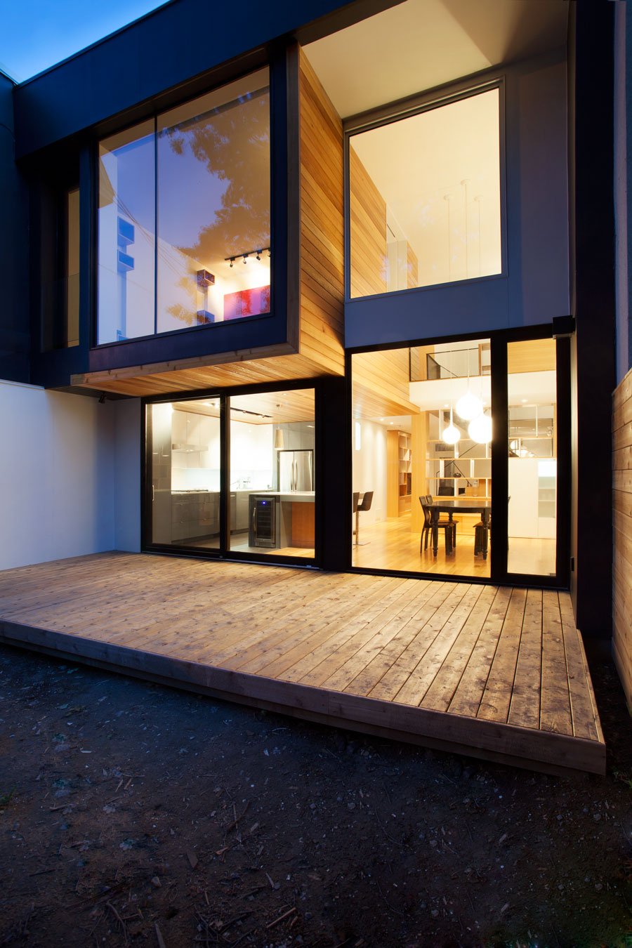 Evening View Residence Exciting Evening View In Chambord Residence Beautified With Gold Themed Of House By Wooden Striped Floor And Dark Linen Windows Interior Design  Creative House With Wood Exteriors And Interior Decorations