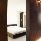 Bedroom Design Bedcover Imposing Bedroom Design With White Bed Cover In Loft Cube Residence That Wooden Door And Wall Decoration Apartments Elegant Modern Loft In Cubic Theme Interior