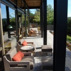 Concrete Terrace Lake Long Concrete Terrace Outside The Lake House With Wooden Chairs And Rounded Side Table Under Wooden Pergola Dream Homes Contemporary Lake House Integrates With Beautiful Natural Landscape