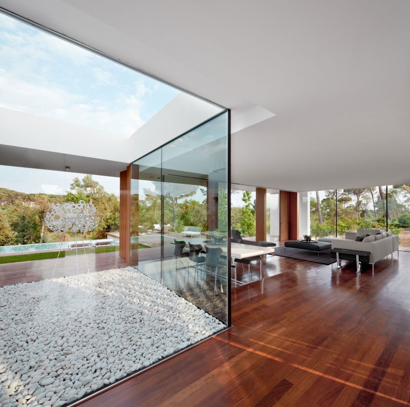 Villa Indigo From Open Villa Indigo Courtyard Seen From Inside With Mounts Of Gravels Covering The Ground Surrounded By Glass Wall Dream Homes  Single Story Modern Residence With Private Swimming Pool In Catalonia