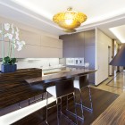 Hidden Light Pendant Sparkling Hidden Light And Gold Pendant Light In Lavish Kitchen Lacquered Wood Kitchen Bar Stylish Metallic Bar Stools Dream Homes Extravagant Luxurious Interior Decoration Brings Warm And Cozy Nuance