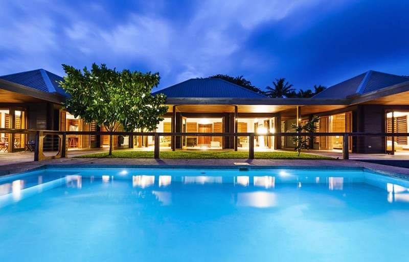 Blue Swimming The Stunning Blue Swimming Pool In The Back Yard Of The Korovesi Home Completed With Wooden Railing Surrounding The Pool Kitchens Elegant Modern Beach Home With Stunning Pacific Ocean View