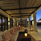 Night View Tropical Stunning Night View Of The Tropical Outdoor Furniture With Caribbean Influences And Long Sofa Under Wide Pergola Dream Homes Impressive Interior Decorating Ideas For Colorful Apartments In Caribbean Style