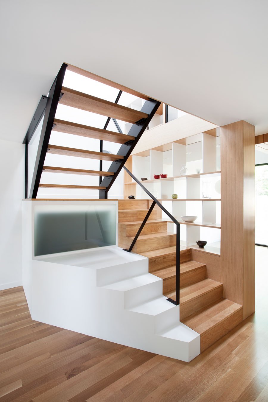 Wooden Stircase Glass Stylish Wooden Staircase With Iron Glass Railing On Wooden Striped Floor Beside Open Built In Storage Of Chambord Residence Interior Design  Creative House With Wood Exteriors And Interior Decorations