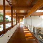 Empty Space Residence Airy Empty Space Inside Chestnut Residence Displaying Wooden Striped Glossy Ceiling And Brown Glossy Floor Involved Wood Glass Windows Dream Homes Amazing Modern Living Room For Luxurious Home Architecture