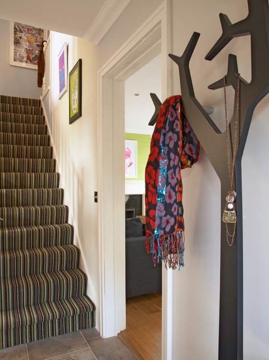 Entry With Artistic Amazing Entry With Striped Staircase Artistic Painting Innovative Tree Shaped Used Coat Racks Lacquered Wood Floor Dark Sofa Decoration Chic And Classy Coat Racks Brimming With Elegant Interior Decorations