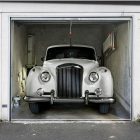 Car Parked Displayed Antique Car Parked Inside Garage Displayed As Garage Door Decals With Messy Look Background With Green Pipes Decoration Creative Garage Door Covers And Decals To Style Your Artistic Garage Door