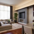 Living Room Grey Appealing Living Room Enhanced With Grey Large Sectional Sofas Ottoman And Potted Trees Placed Next To Fireplace Decoration Swanky Large Sectional Sofas For Spacious Living Rooms