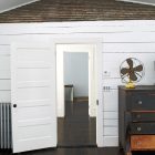 White Door Floating Attractive White Door In The Floating Farmhouse With White Wall And Wooden Dresser On Hardwood Floor Apartments Bewitching Modern Farmhouse With White Color And Rustic Appearance