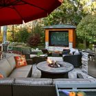 Outdoor Sectional With Awesome Outdoor Sectional Sofa Added With Umbrella Coupled With Round Coffee Table And Fireplace On Center Decoration Cozy And Beautiful Outdoor Sectional Sofas For Patio Relaxation