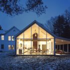 Lighting Inside Farmhouse Bright Lighting Inside The Floating Farmhouse With Long Dining Room Seen From The Wide Glass Walls Apartments Bewitching Modern Farmhouse With White Color And Rustic Appearance