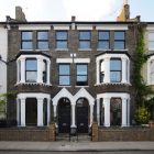 House With Wall Classic House With Rustic Stone Wall Glass Bay Window Dark Metallic Fence Ornamental Plants Arched Door Dream Homes Elegant Black And White House In London By Bureau De Change Design Office