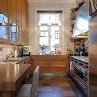 Wooden Built On Classic Wooden Built In Storage On White Tiled Floor Kitchen Of Traditional Swedish Apartment Involved Silver Stove And Oven Apartments Vintage Swedish Home Decorated With Contemporary Scandinavian Touch Of Traditional Style