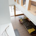 White Themed Seen Clean White Themed Living Room Seen From Upper Level Floor Displaying Grey Tufted Large Sectional Sofas Set Decoration Swanky Large Sectional Sofas For Spacious Living Rooms