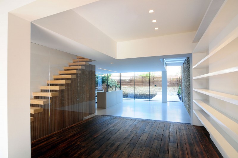 Wood Staircase Light Enchanting Wood Staircase Bright Ceiling Light Wood Floor White Wall Shelves Glass Wall Contemporary White Kitchen Island Dream Homes  Elegant Black And White House In London By Bureau De Change Design Office