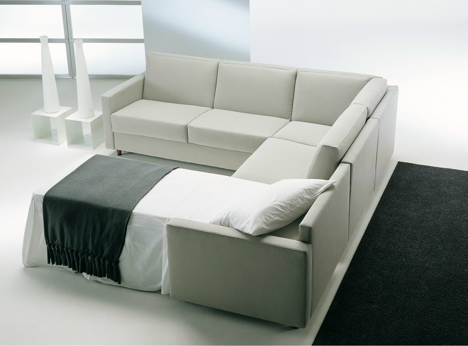 Modern Living By Excellent Modern Living Room Design By Prodotti With White Colored Convertible Sofa White Pillows And Black Floor Mat Decoration Comfortable And Contemporary Convertible Sofa In Soft Color Schemes