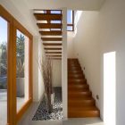 Glass Potted Stone Fabulous Glass Potted Plants On Stone Patterned Floor Beside Wooden Staircase And Gray Tiled Glossy Floor Chestnut Residence Dream Homes Amazing Modern Living Room For Luxurious Home Architecture