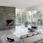 Modern Living Interior Fantastic Modern Living Room Design Interior With Stone Fireplace Design Used Small Grey Sofa Furniture And Glass Wall Decor Fireplace Classic Yet Contemporary Stone Fireplace For Wonderful Family Rooms