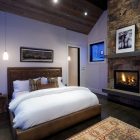 Rustic Bedroom Completed Gorgeous Rustic Bedroom Design Interior Completed With Small Stone Fireplace Design And Vintage Rug Decoration Ideas Fireplace Classic Yet Contemporary Stone Fireplace For Wonderful Family Rooms