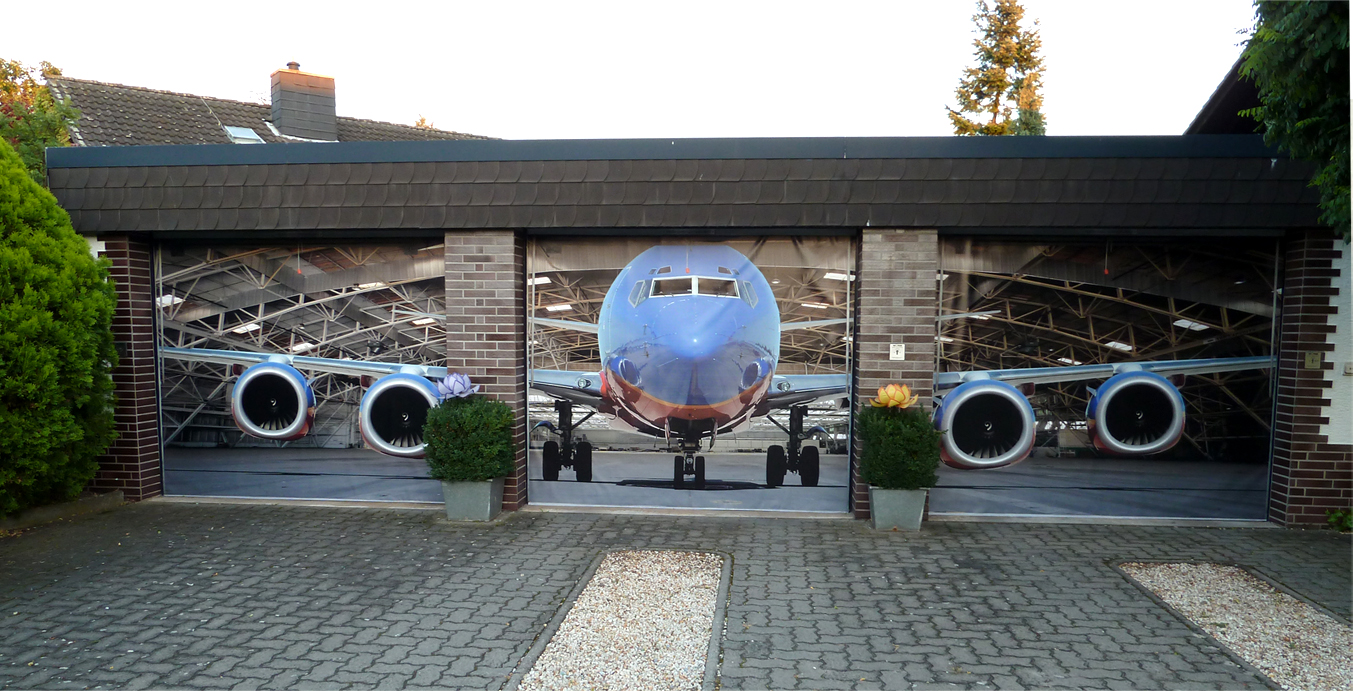 Garage Door Displaying Great Garage Door Decals Idea Displaying Huge Air Plane Parked Inside The Garage With Three Garage Door Panels Decoration Creative Garage Door Covers And Decals To Style Your Artistic Garage Door