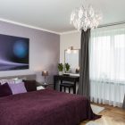 Modern Bedroom Bed Iconic Modern Bedroom With Lavish Bed And Purple Duvet Cover Modern Painting Glossy Crystal Chandelier Shiny Table Lamp On Glass Bedside Tables Bedroom Comfortable Purple Duvet Covers For Your Beautiful Bedroom Sets