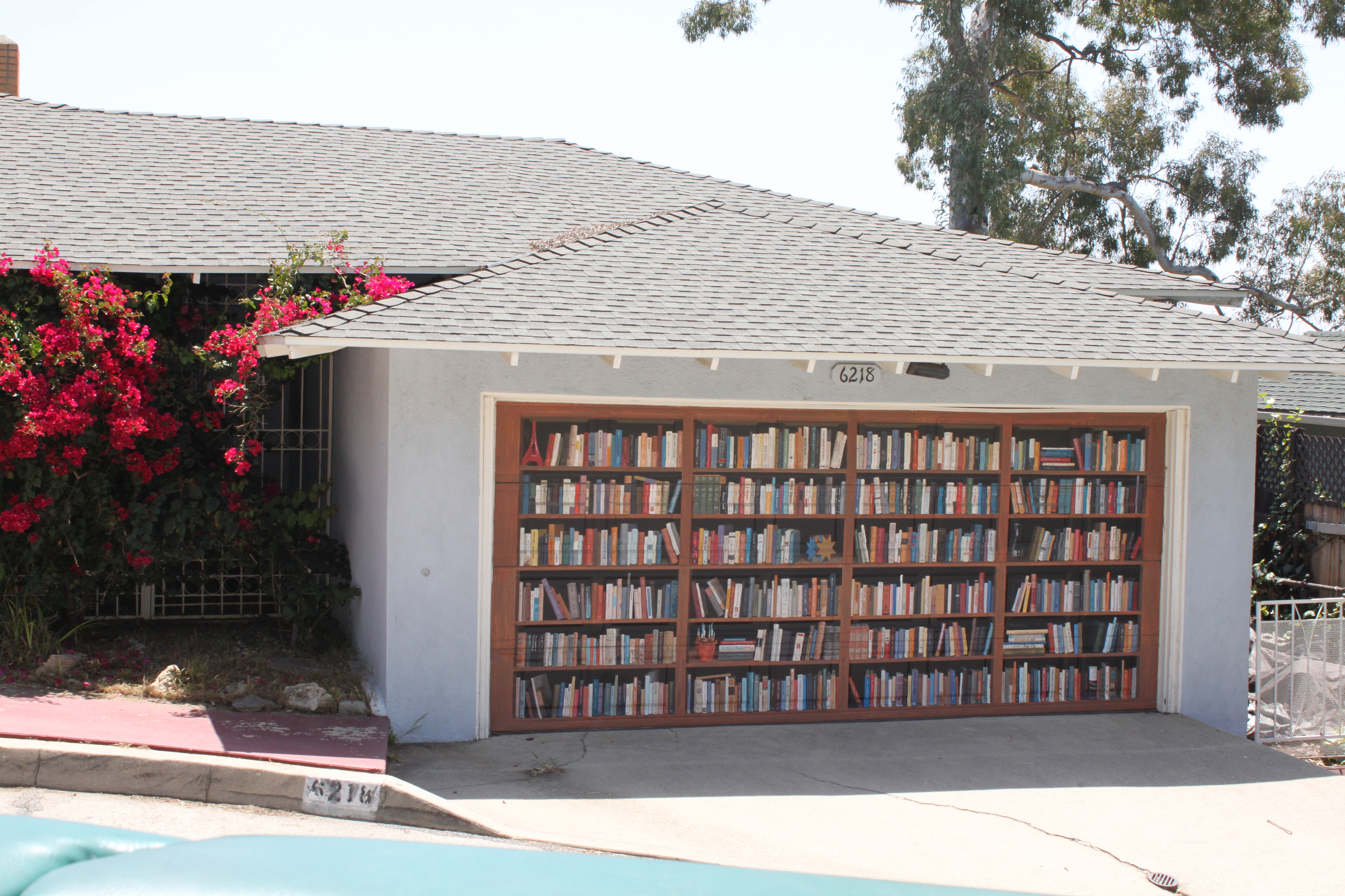 Garage Door Simple Interesting Garage Door Decals Of Simple House With Wooden Inset Bookcase As Main Image To Attract Attention Decoration Creative Garage Door Covers And Decals To Style Your Artistic Garage Door