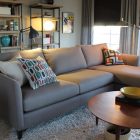 Century Home Enhanced Mid Century Home Family Room Enhanced With Small Sectional Sofas In Grey With Colorful Pillows As Decoration Decoration Small Sectional Sofas With Square Coffee Tables For Looking Stylish