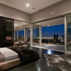 Bedroom With And Pretty Bedroom With Modern Bed And A White Arm Chair In The Luxury Home In LA Architecture Luxurious And Modern Concrete Home With Long Swimming Pools