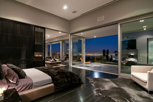 Bedroom With And Pretty Bedroom With Modern Bed And A White Arm Chair In The Luxury Home In LA Architecture  Luxurious And Modern Concrete Home With Long Swimming Pools