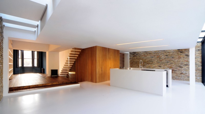 Wood Floating Stone Small Wood Floating Staircase Rustic Stone Wall Compact White Kitchen Island In White Themed House Soft LED Light Dream Homes Elegant Black And White House In London By Bureau De Change Design Office