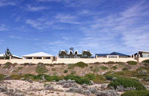 Concrete Wall Construction Strong Concrete Wall Fences Surrounding Construction Of Flo House Building Accompanied With Sandy Nearby Beach Area Dream Homes Contemporary Australian Home With Unique Cantilever Roofing And Buildings