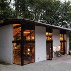 Night View Nautilus Stunning Night View Of The Nautilus Studio With White Wall And Wide Glass Walls Under The Curve Roof Decoration Small And Beautiful Home Studio Designed For A Textile Artist